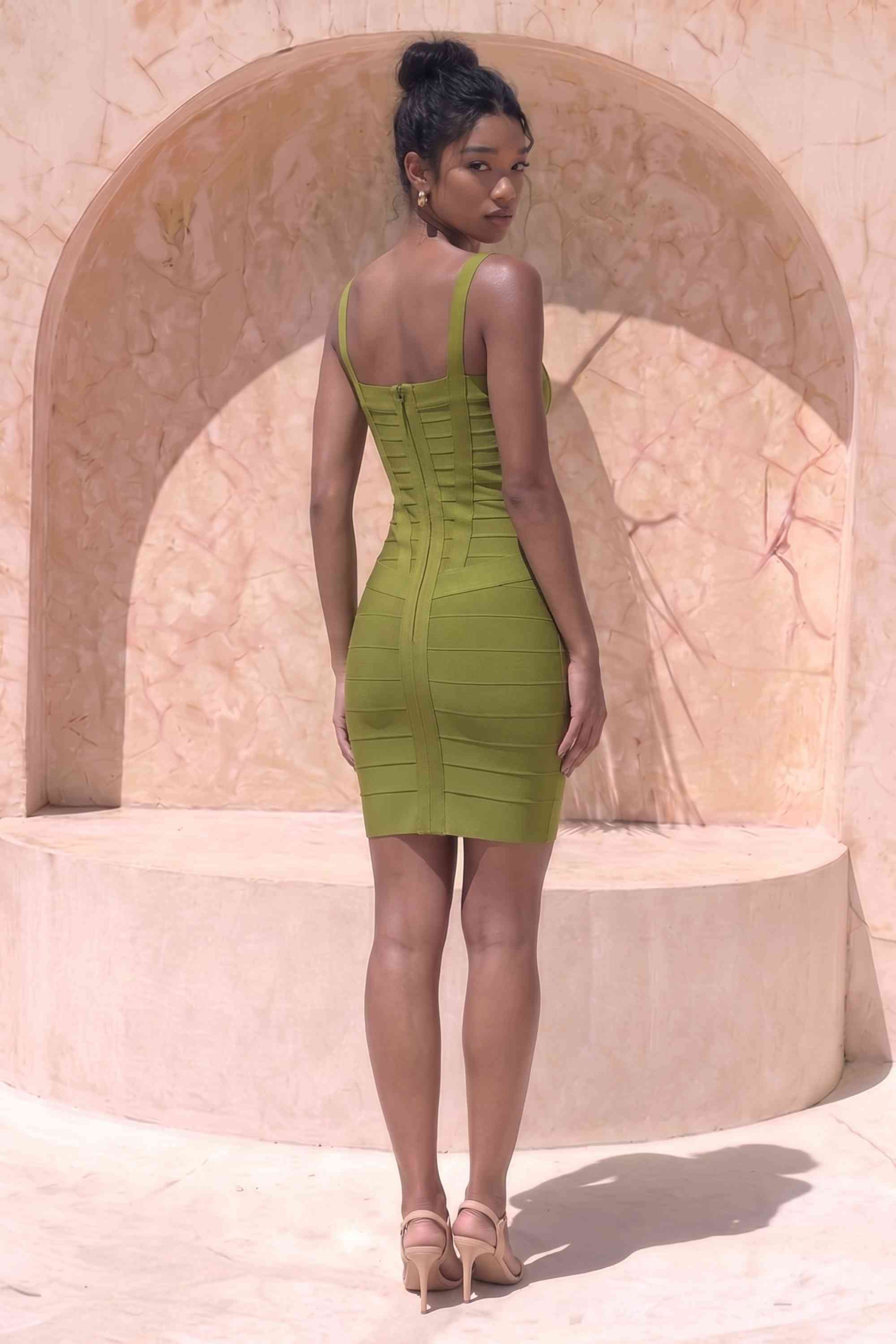 Woman wearing a figure flattering  Heidi Bandage Mini Dress - Olive Green Bodycon Collection