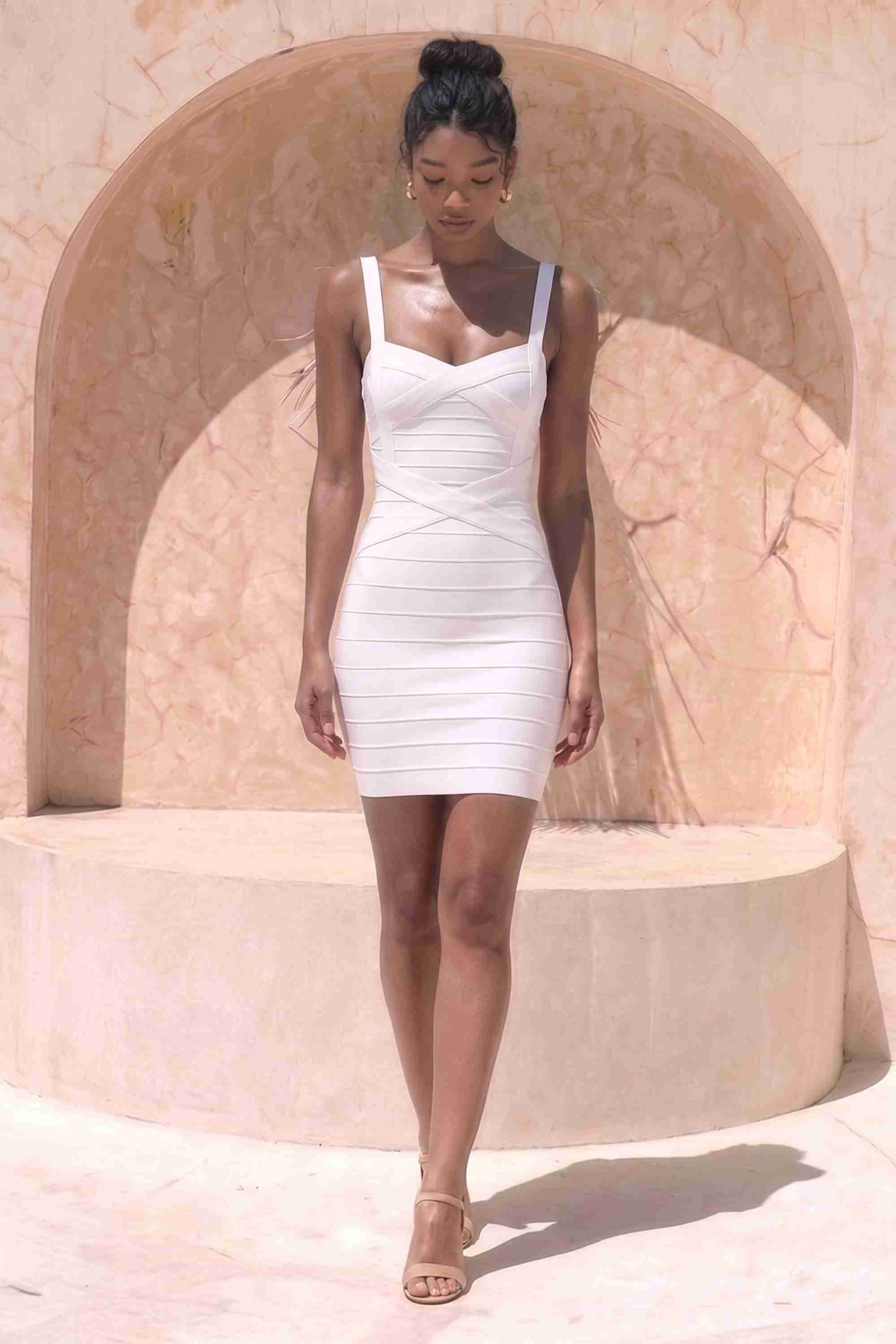 Woman wearing a figure flattering  Heidi Bandage Mini Dress - White Pearl Bodycon Collection