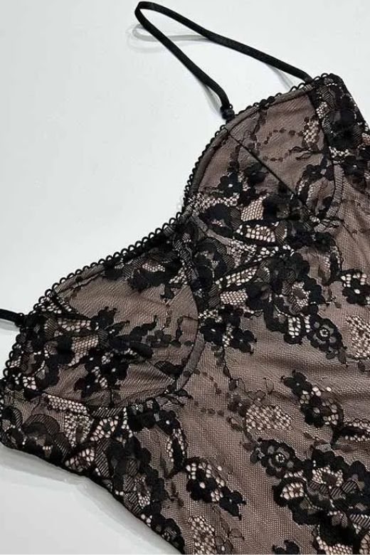 Woman wearing a figure flattering  Joan Bodycon Dress - Classic Black BODYCON COLLECTION