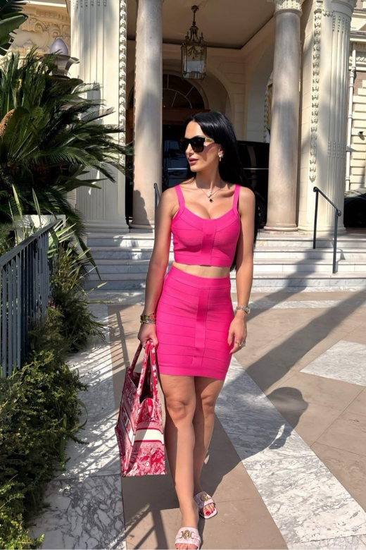 Woman wearing a figure flattering  India Bandage Top and Mini Skirt Outfit Set - Hot Pink BODYCON COLLECTION