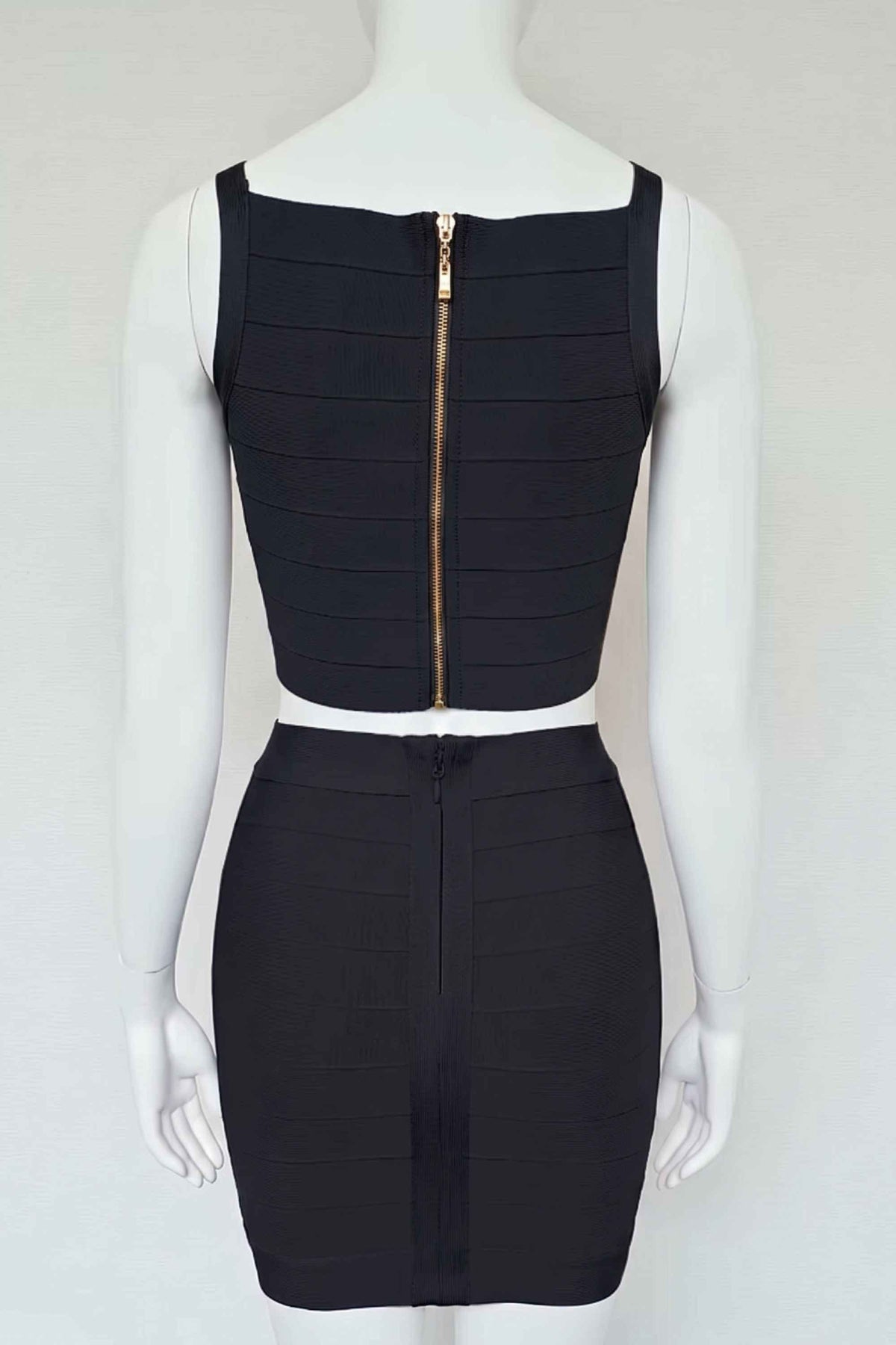 Woman wearing a figure flattering  India Bandage Top and Mini Skirt Set - Classic Black BODYCON COLLECTION