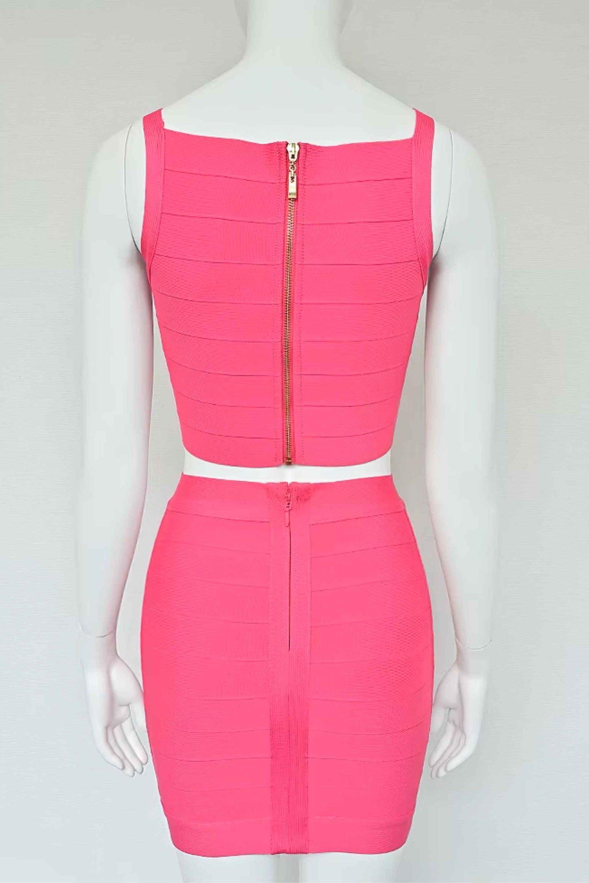Woman wearing a figure flattering  India Bandage Top and Mini Skirt Set - Hot Pink BODYCON COLLECTION