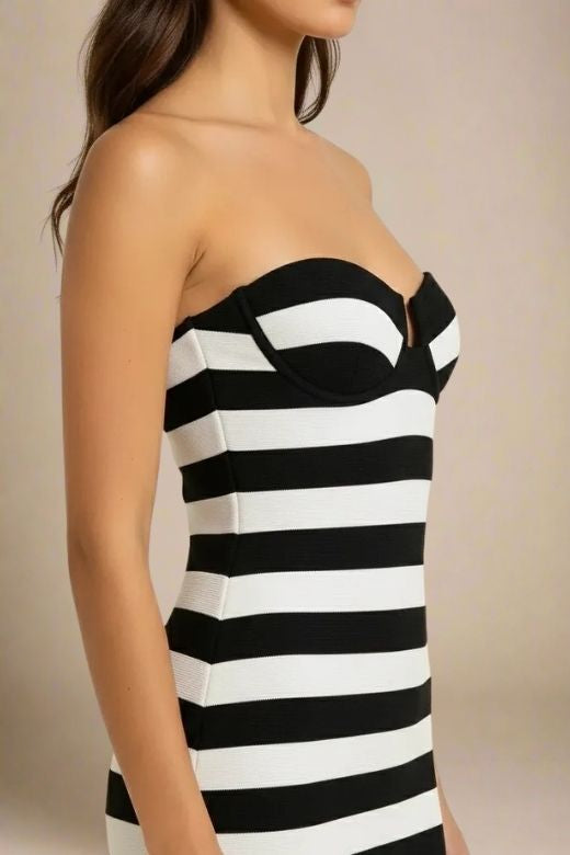 Woman wearing a figure flattering  Ingrid Bandage Mini Dress - Classic Black BODYCON COLLECTION