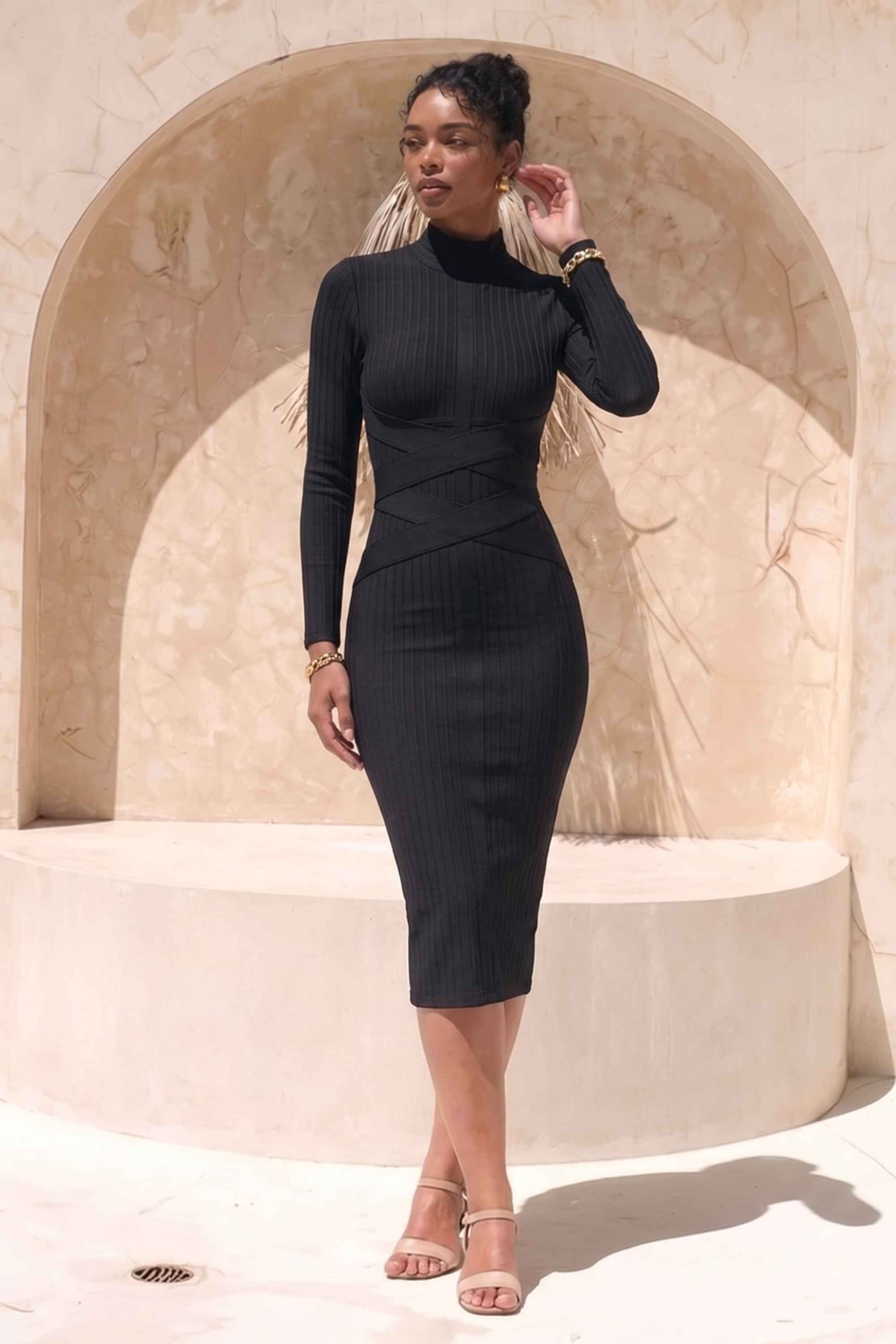 Woman wearing a figure flattering  Jane Long Sleeve Bodycon Midi Dress - Classic Black Bodycon Collection
