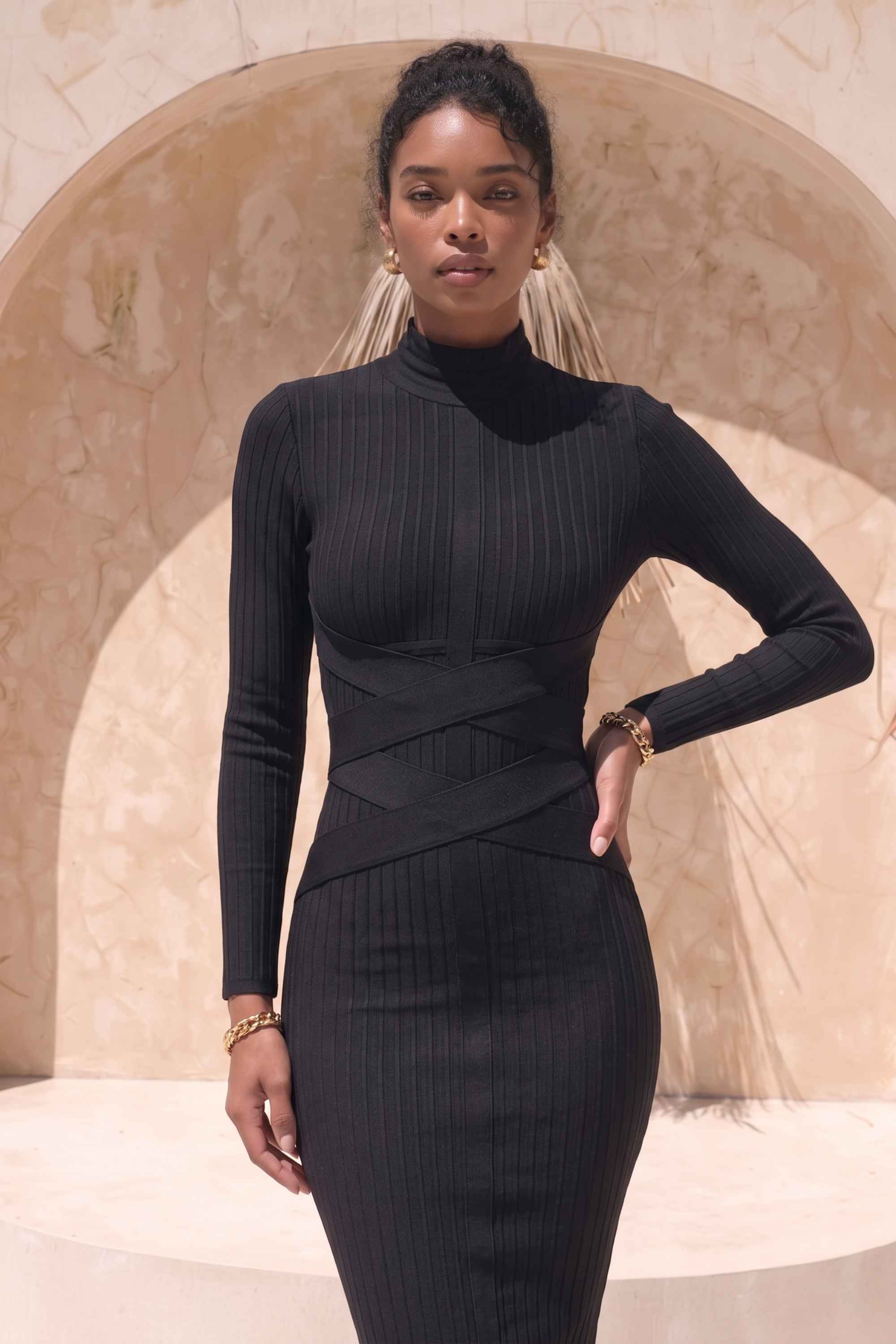 Woman wearing a figure flattering  Jane Long Sleeve Bodycon Midi Dress - Classic Black Bodycon Collection