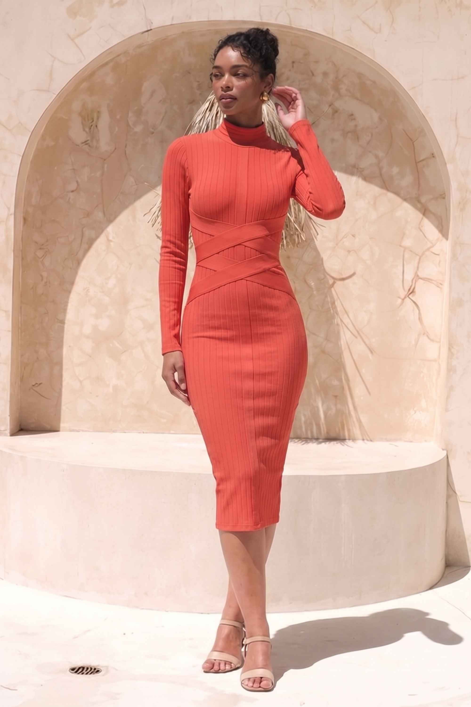 Woman wearing a figure flattering  Jane Long Sleeve Bodycon Midi Dress - Lipstick Red Bodycon Collection