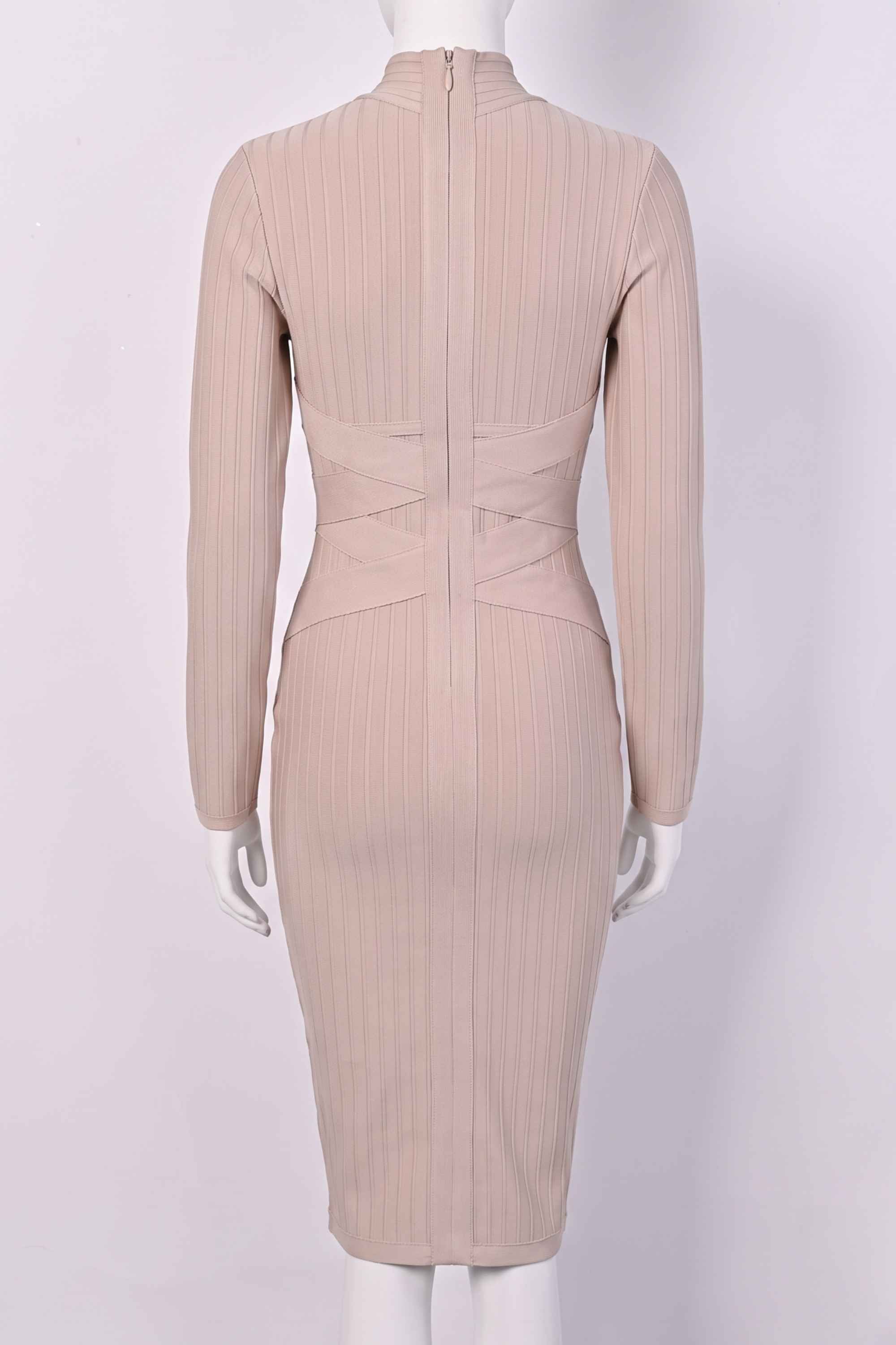 Woman wearing a figure flattering  Jane Long Sleeve Bodycon Midi Dress - Nude Bodycon Collection