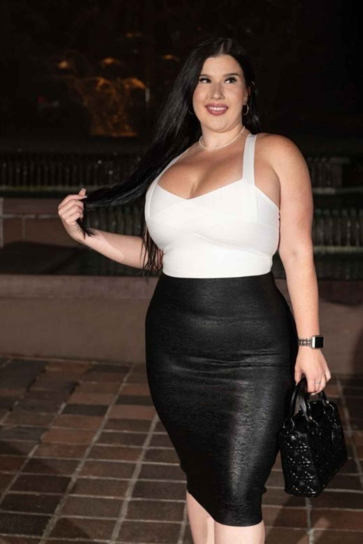 Woman wearing a figure flattering  Jay Bandage Crop Top - Classic Black BODYCON COLLECTION