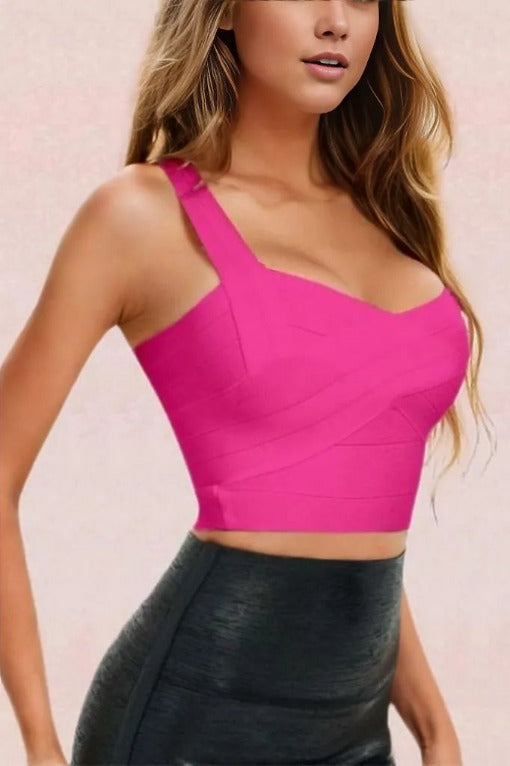 Woman wearing a figure flattering  Jay Bandage Crop Top - Hot Pink BODYCON COLLECTION