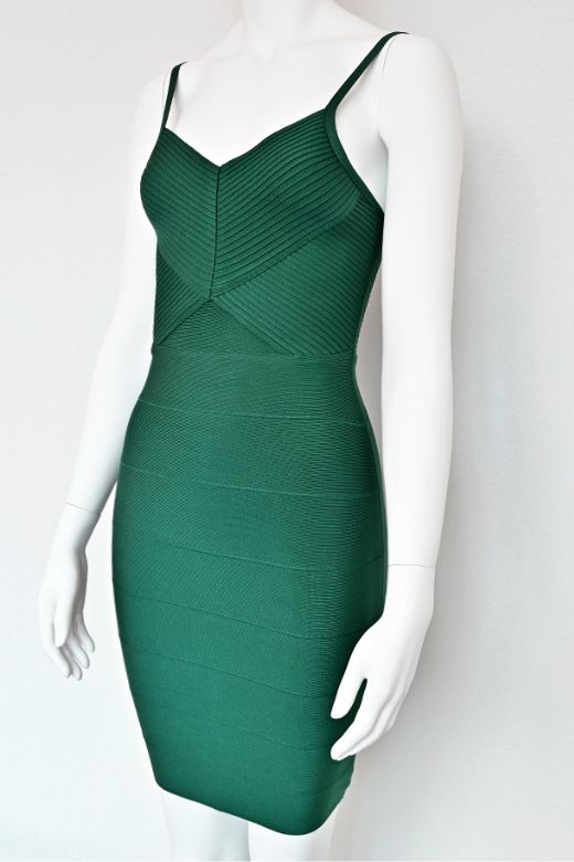 Woman wearing a figure flattering  Jene Bandage Dress - Emerald Green BODYCON COLLECTION