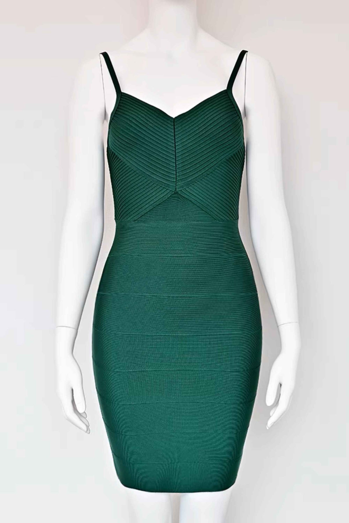 Woman wearing a figure flattering  Jene Bandage Dress - Emerald Green BODYCON COLLECTION