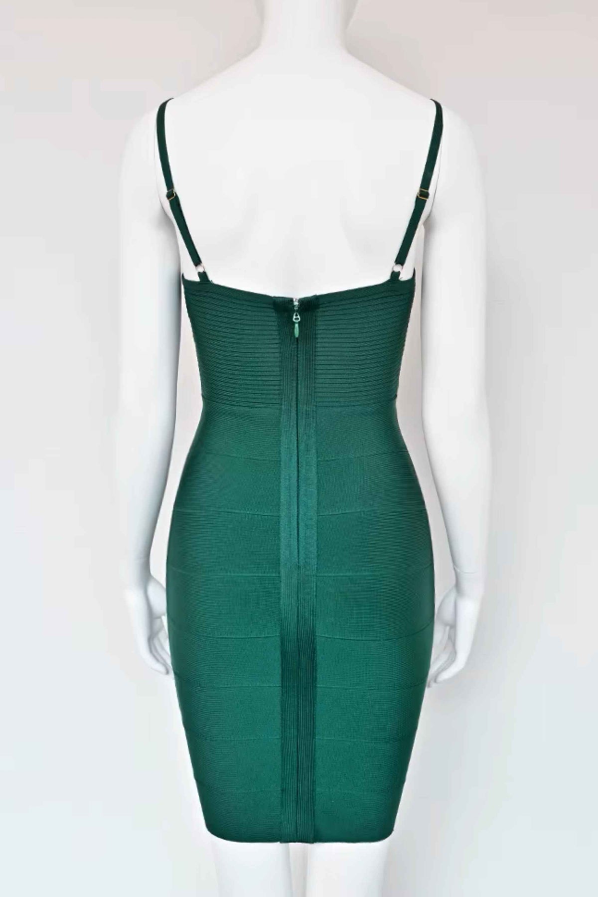 Woman wearing a figure flattering  Jene Bandage Dress - Emerald Green BODYCON COLLECTION