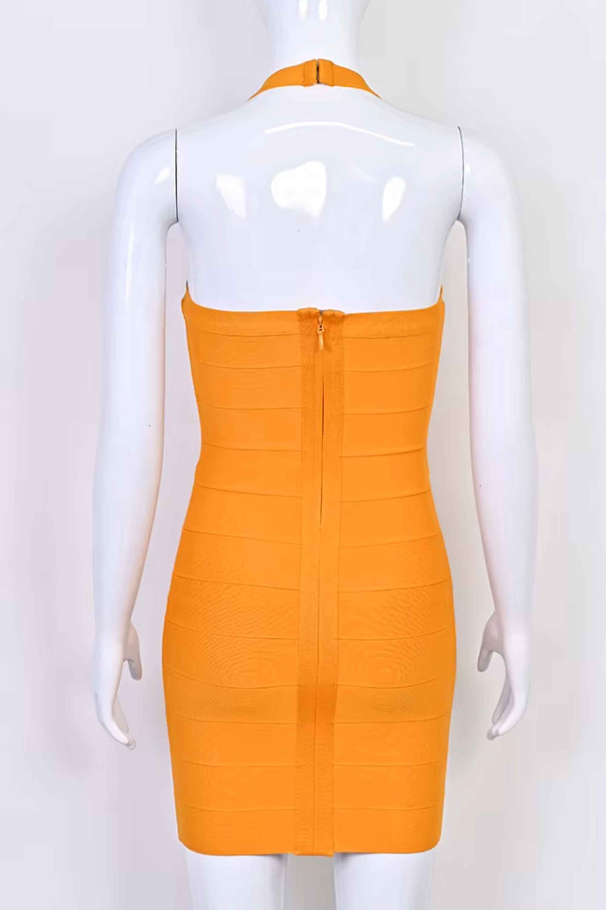 Woman wearing a figure flattering  Jenna Bandage Mini Dress - Apricot Orange BODYCON COLLECTION Pty Ltd