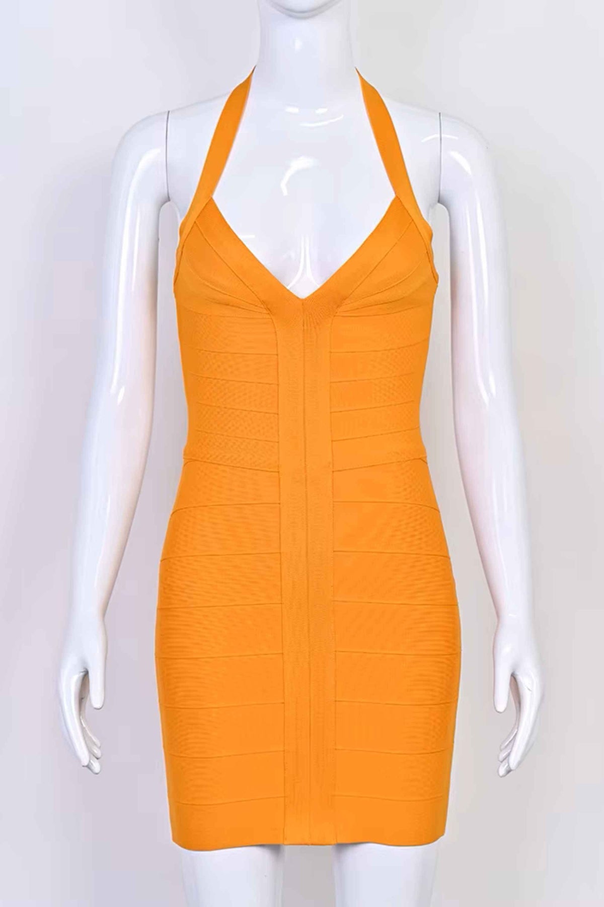 Woman wearing a figure flattering  Jenna Bandage Mini Dress - Apricot Orange BODYCON COLLECTION Pty Ltd
