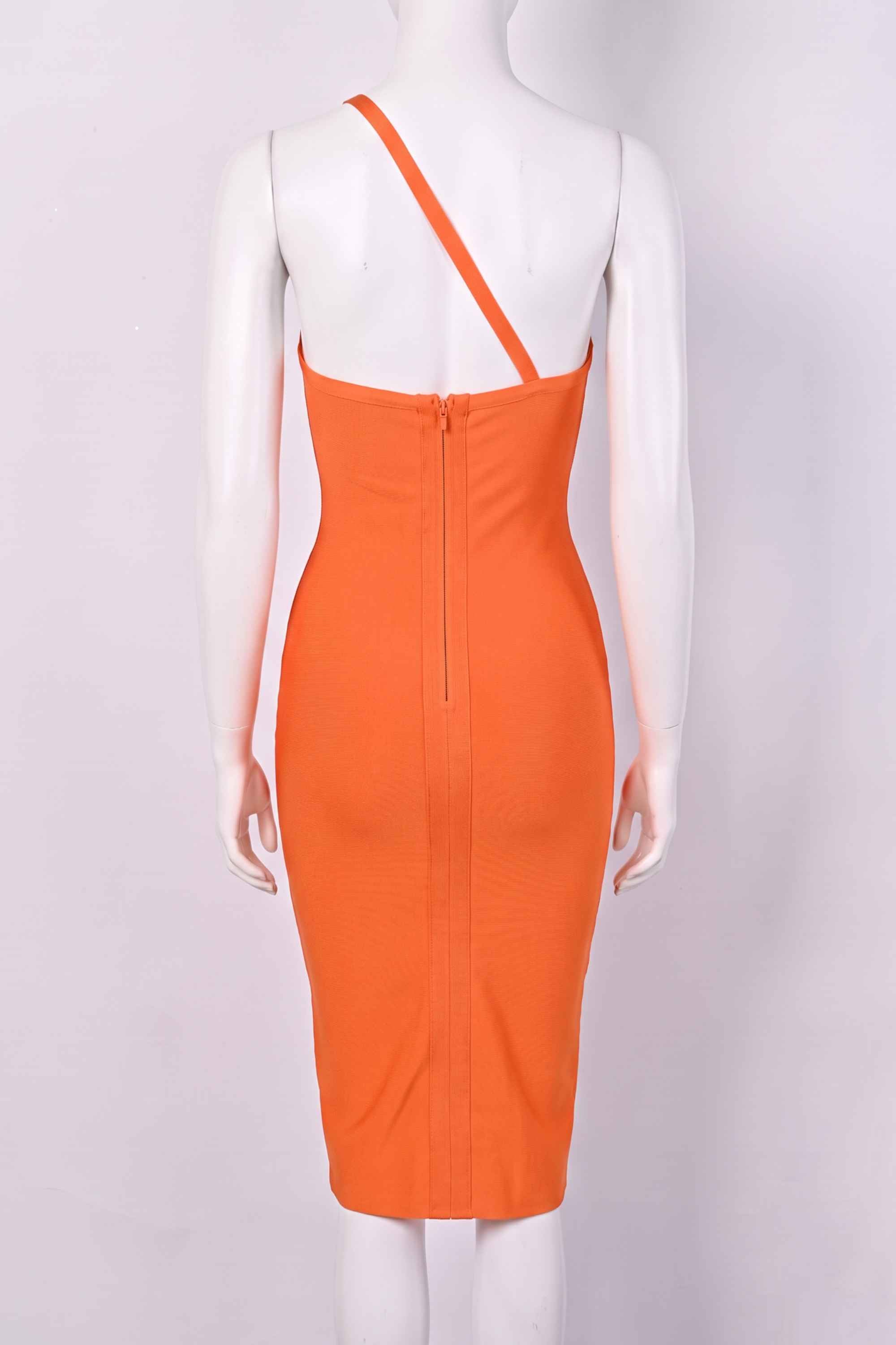 Woman wearing a figure flattering  Joi Bodycon Midi Dress - Apricot Orange Bodycon Collection