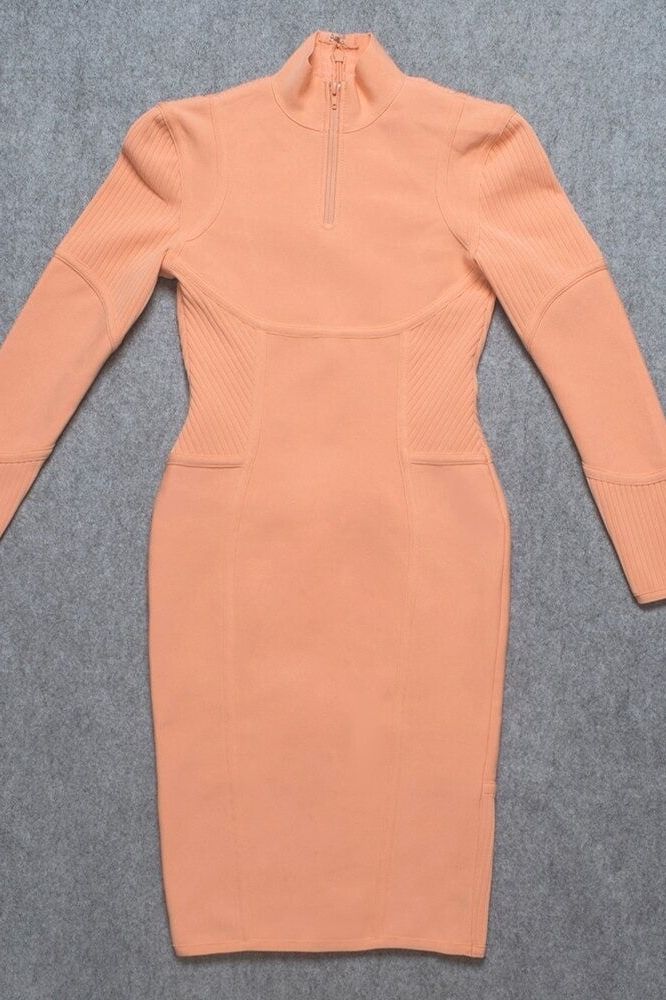 Woman wearing a figure flattering  Jordan Long Sleeve Bodycon Dress - Peach Bodycon Collection