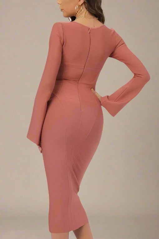 Woman wearing a figure flattering  Jules Long Sleeve Midi Bandage Dress - Watermelon Pink BODYCON COLLECTION