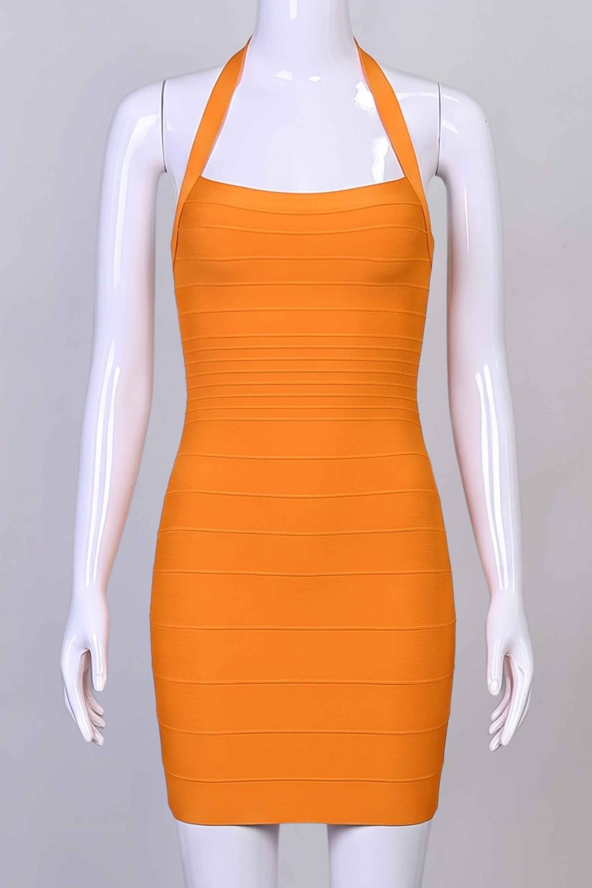 Woman wearing a figure flattering  Kia Bandage Mini Dress - Apricot Orange BODYCON COLLECTION Pty Ltd