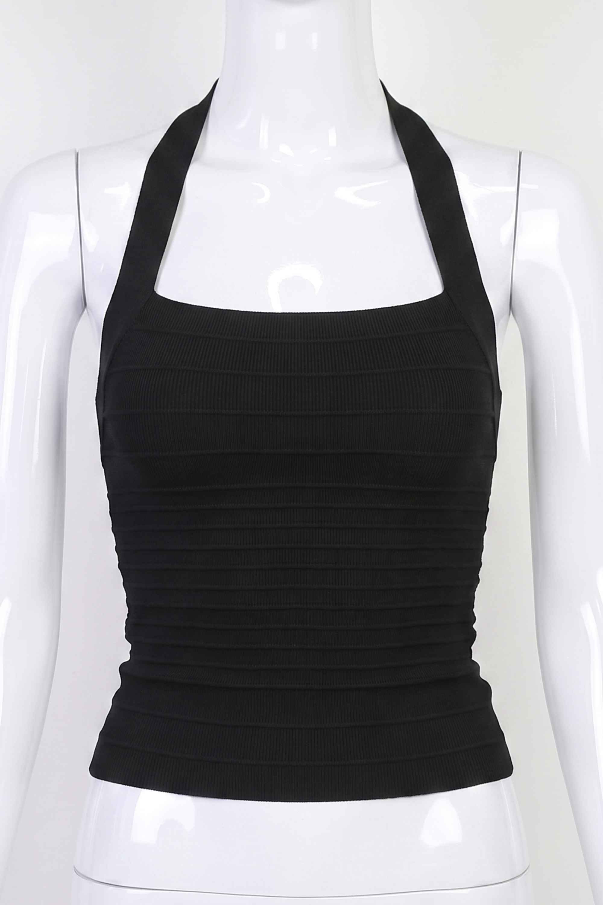 Woman wearing a figure flattering  Kia Bandage Top - Classic Black BODYCON COLLECTION Pty Ltd