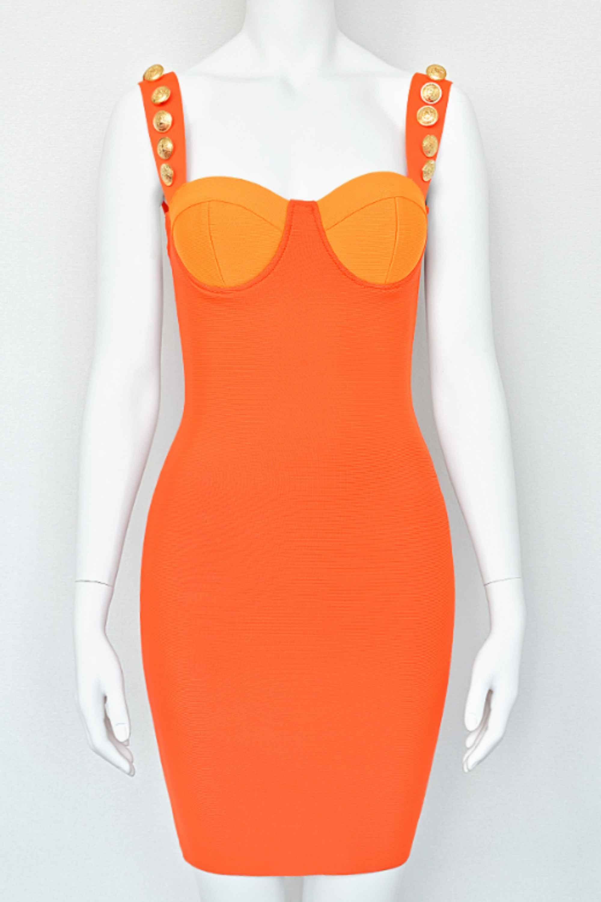Woman wearing a figure flattering  Kiki Bandage Mini Dress - Apricot Orange BODYCON COLLECTION