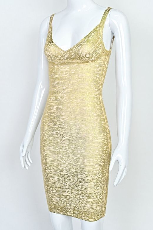 Woman wearing a figure flattering  Kit Bandage Dress - Gold Bodycon Collection