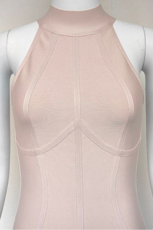 Woman wearing a figure flattering  Lea Bandage Midi Dress - Beige Bodycon Collection