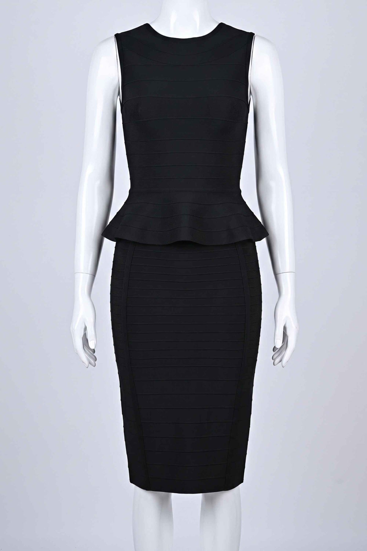 Woman wearing a figure flattering  Leni Bandage Top and Knee Length Skirt Set - Classic Black BODYCON COLLECTION