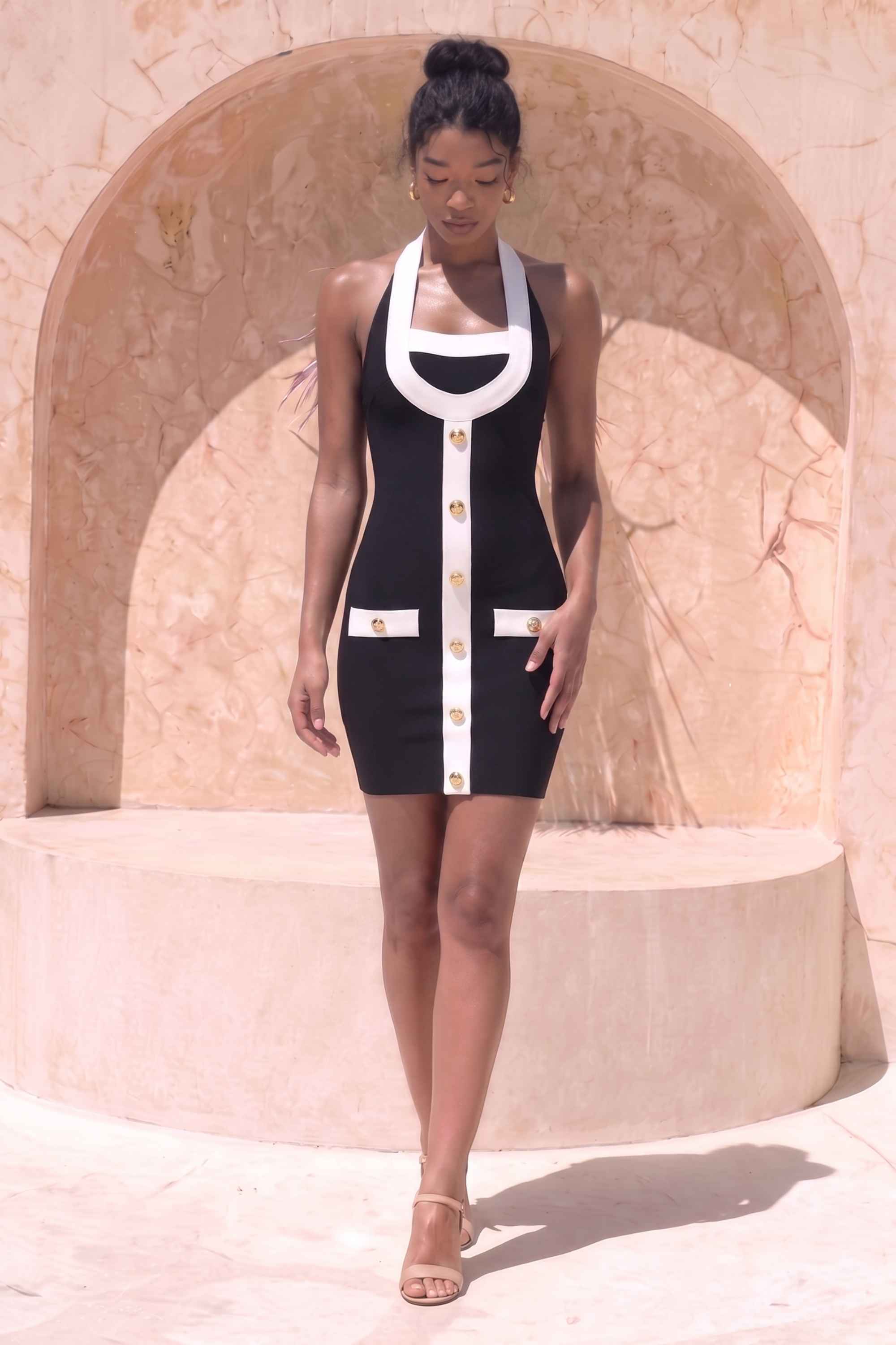 Woman wearing a figure flattering  Leone Bandage Mini Dress - Classic Black BODYCON COLLECTION Pty Ltd