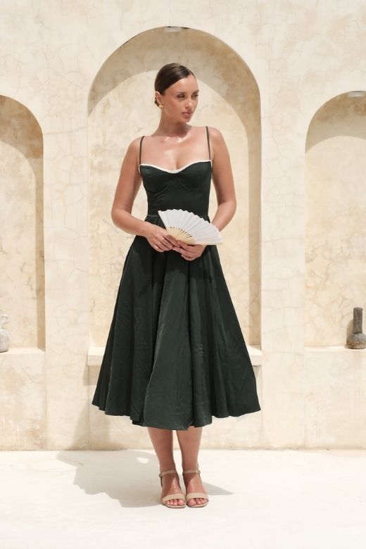 Woman wearing a figure flattering  Mavis Midi Dress - Classic Black BODYCON COLLECTION