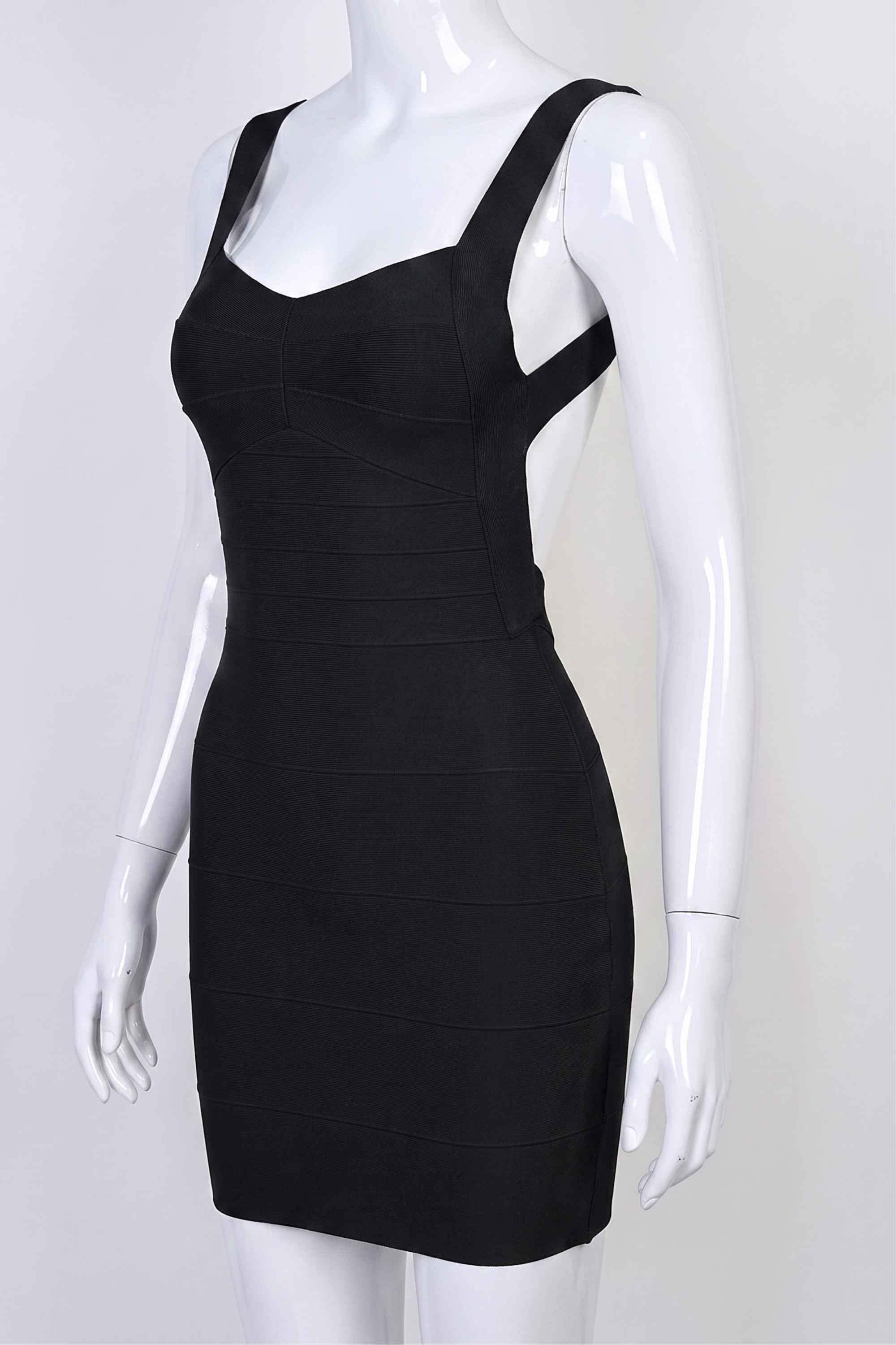 Woman wearing a figure flattering  Maya Bandage Mini Dress - Classic Black BODYCON COLLECTION