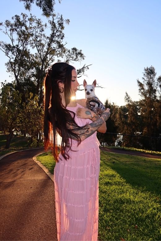 Woman wearing a figure flattering  Meryl Wrap Top and Maxi Skirt Set - Pink Fuzz BODYCON COLLECTION