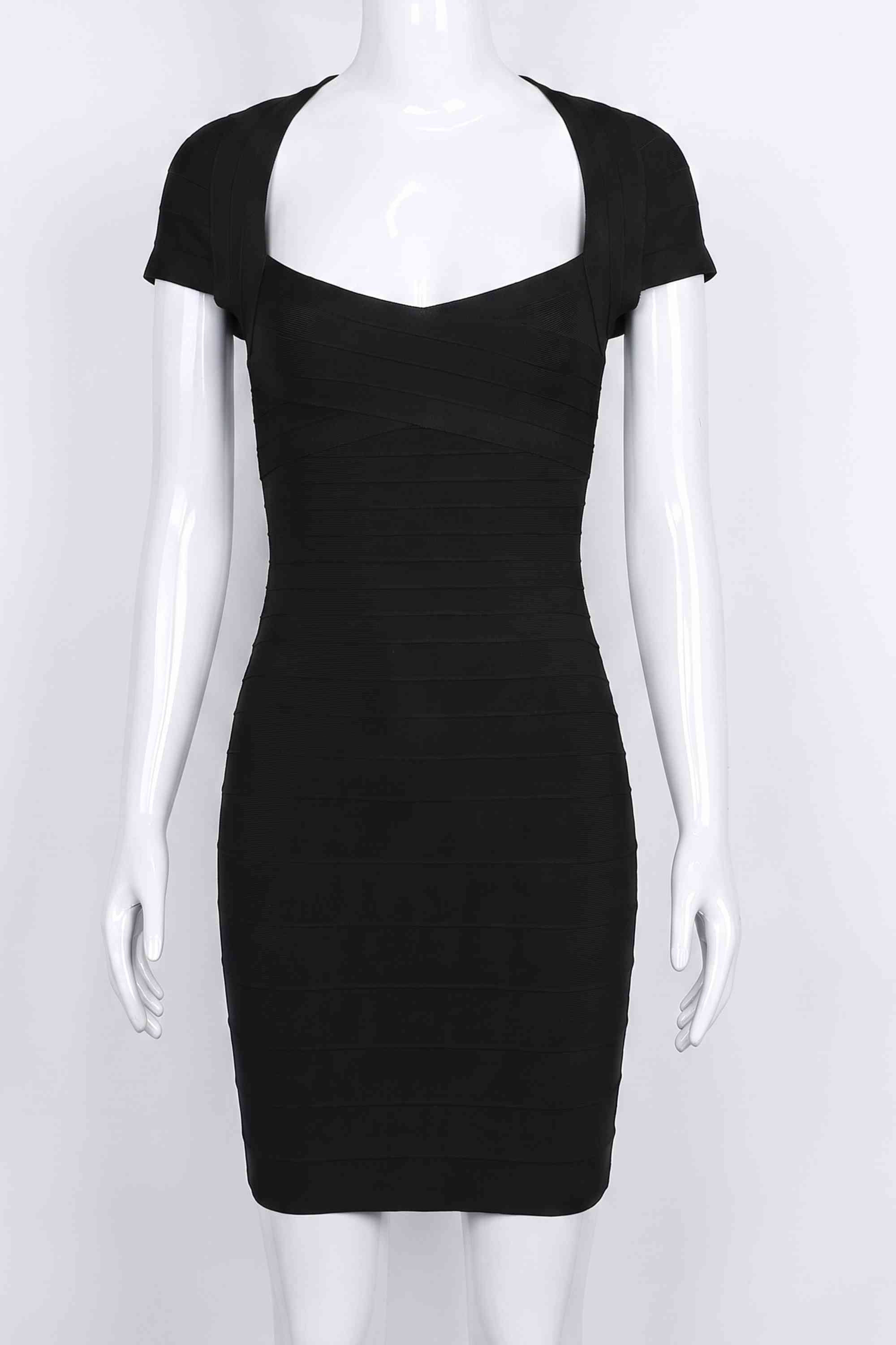 Woman wearing a figure flattering  Miranda Bandage Mini Dress - Classic Black Bodycon Collection