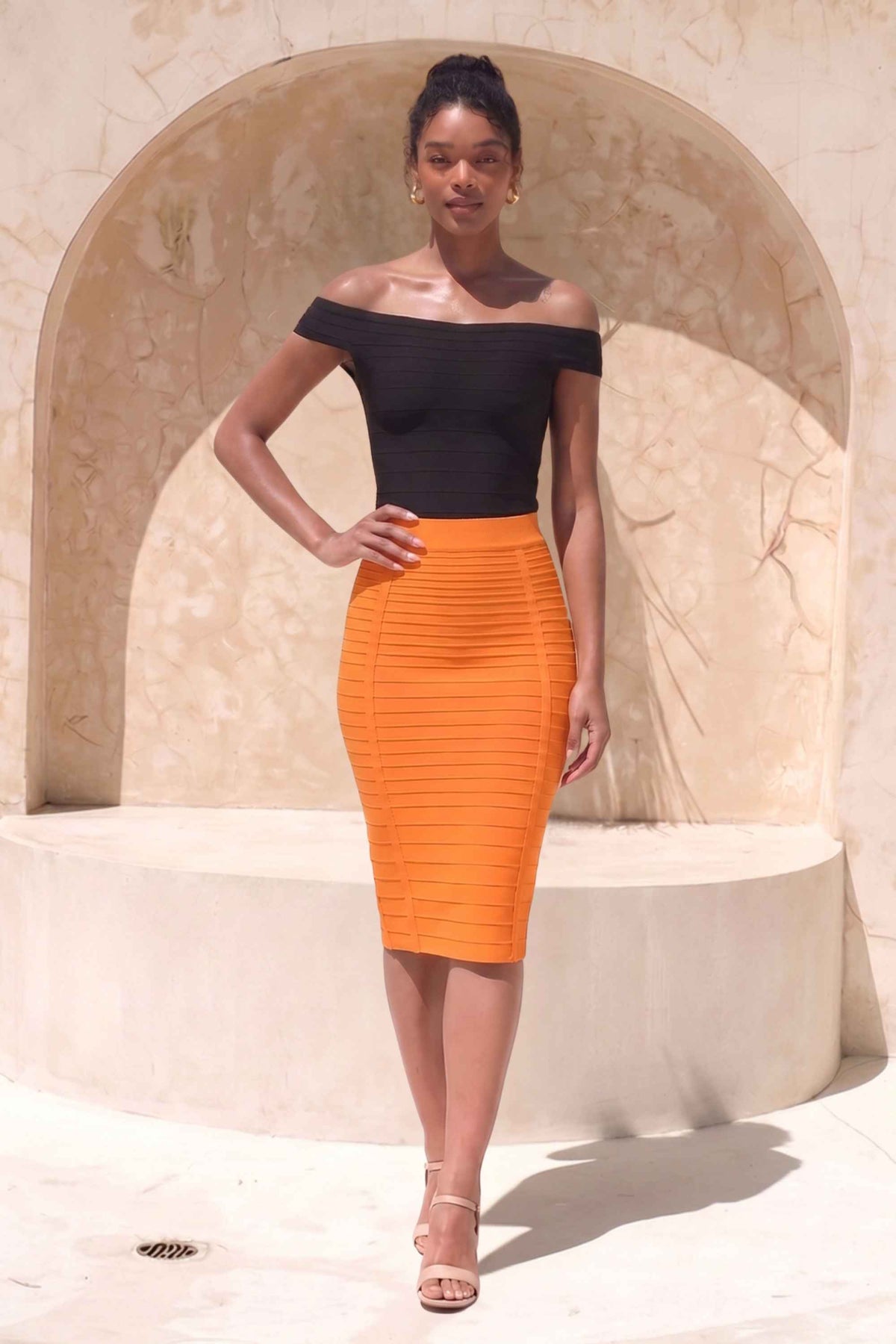 Woman wearing a figure flattering  Pencil High Waist Bandage Knee Length Knitted Skirt - Apricot Orange BODYCON COLLECTION