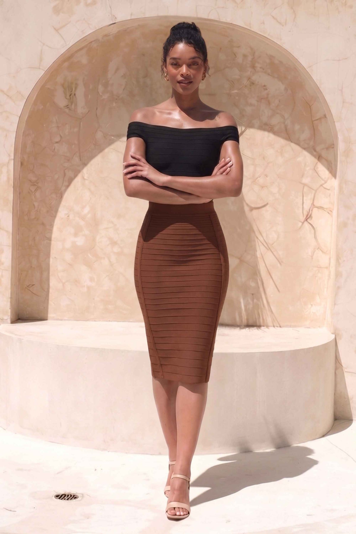 Woman wearing a figure flattering  Pencil High Waist Bandage Knee Length Knitted Skirt - Tan Brown BODYCON COLLECTION