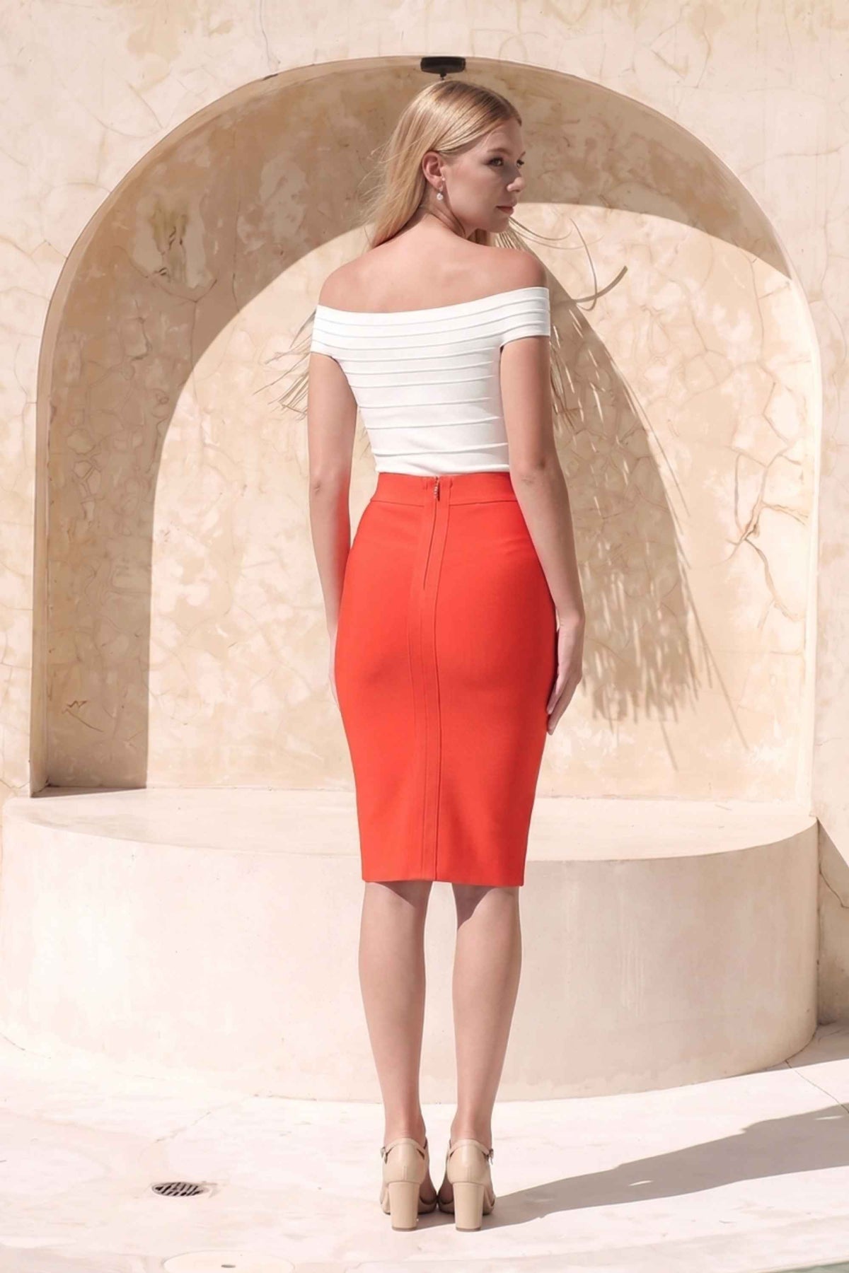 Woman wearing a figure flattering  Pencil High Waist Bandage Knee Length Skirt - Lipstick Red BODYCON COLLECTION