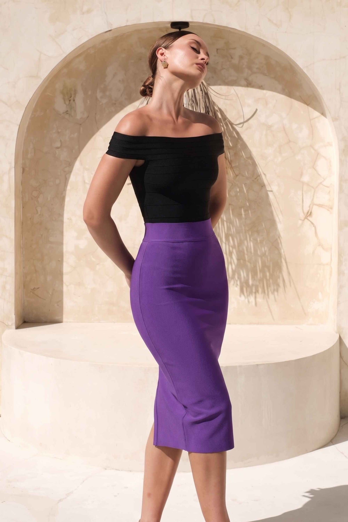 Woman wearing a figure flattering  Pencil High Waist Bandage Midi Skirt - Plum Purple BODYCON COLLECTION