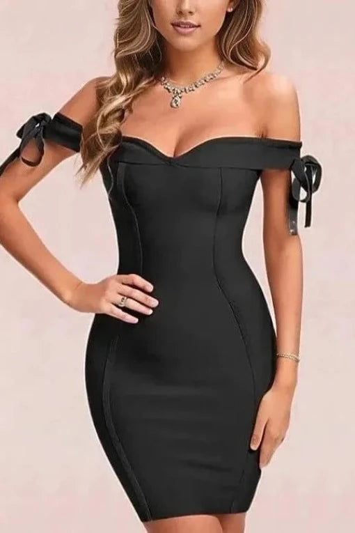 Woman wearing a figure flattering  Penelope Bandage Mini Dress - Classic Black BODYCON COLLECTION