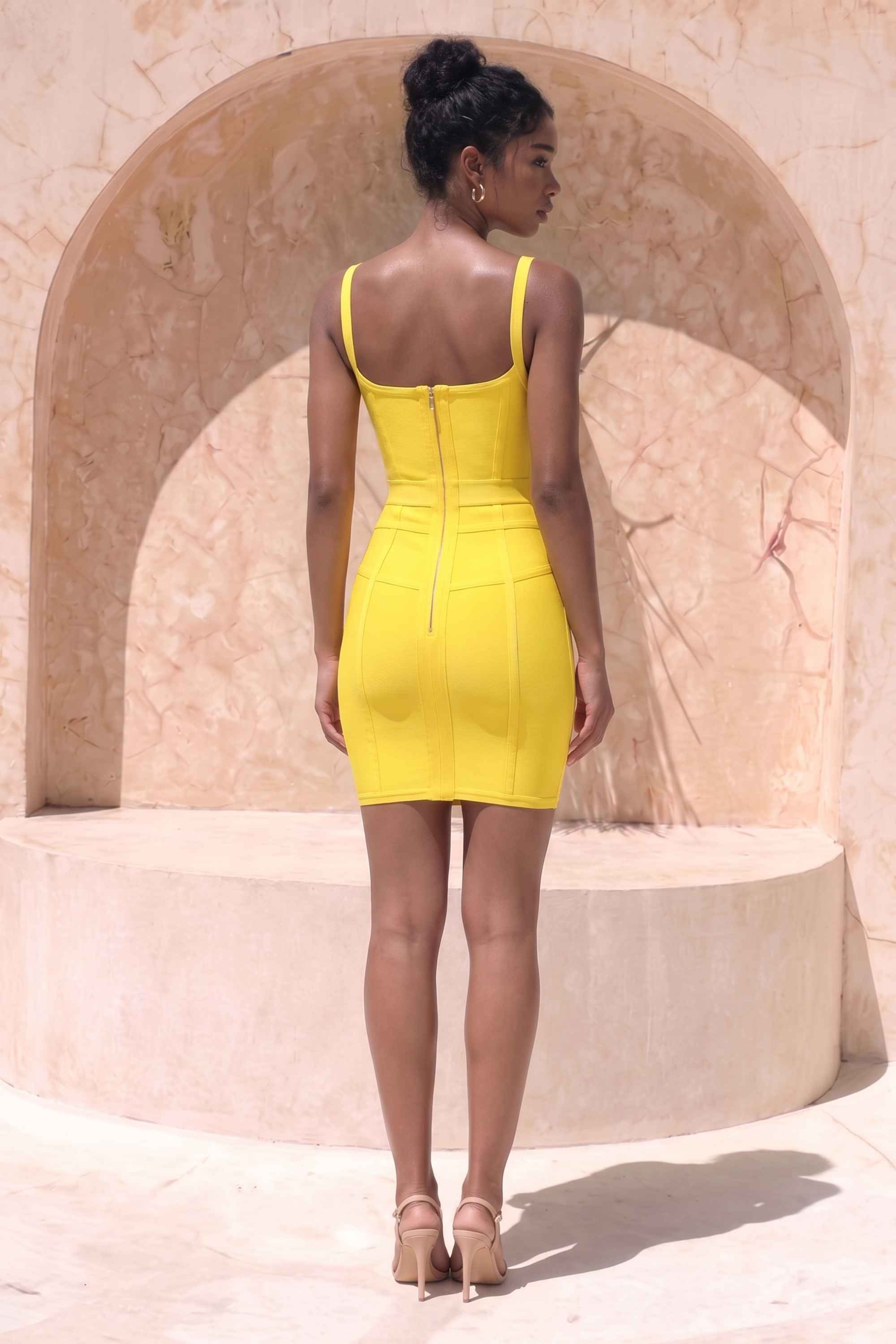Woman wearing a figure flattering  Pip Bandage Mini Dress - Sun Yellow BODYCON COLLECTION