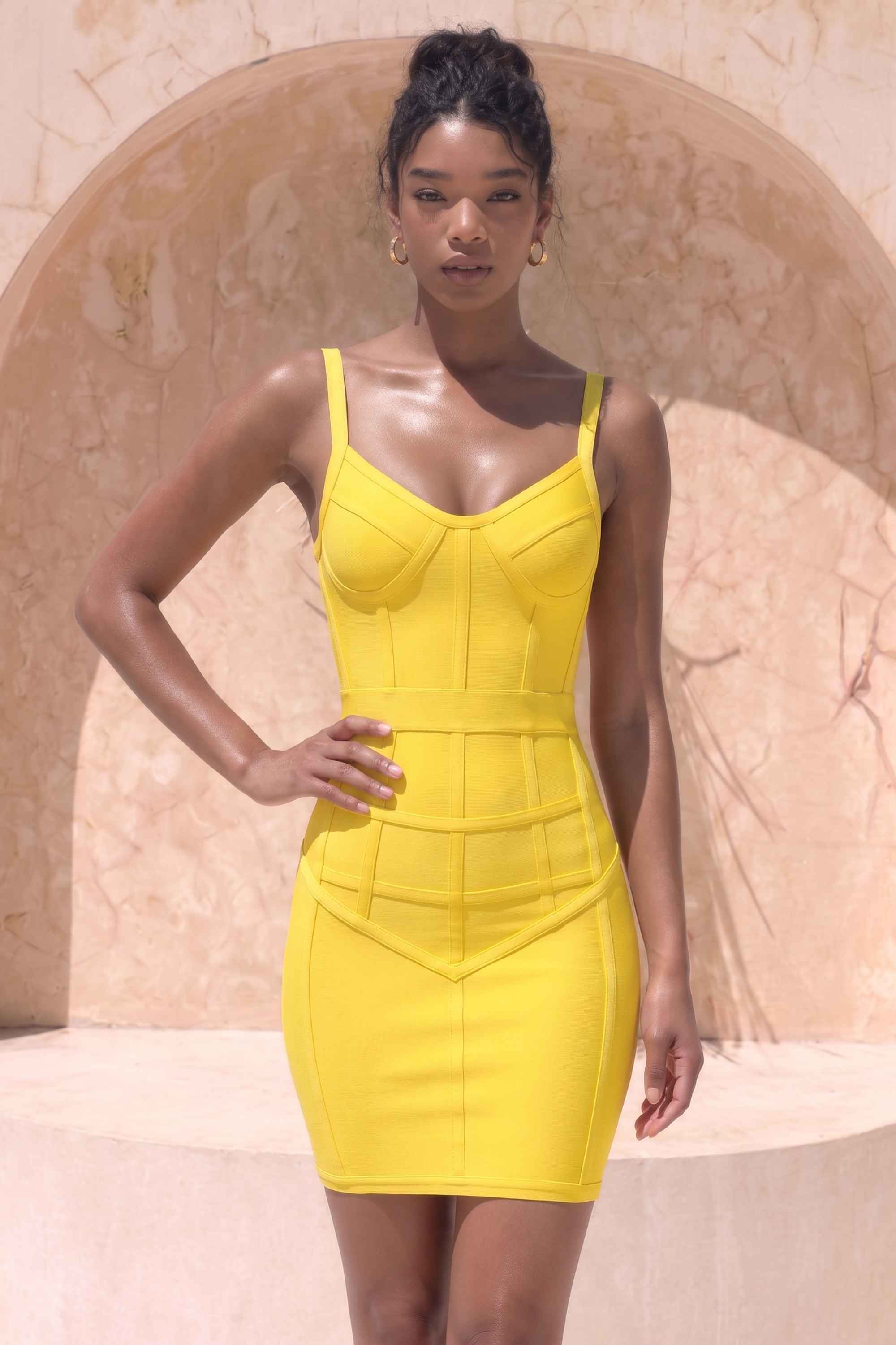 Woman wearing a figure flattering  Pip Bandage Mini Dress - Sun Yellow BODYCON COLLECTION