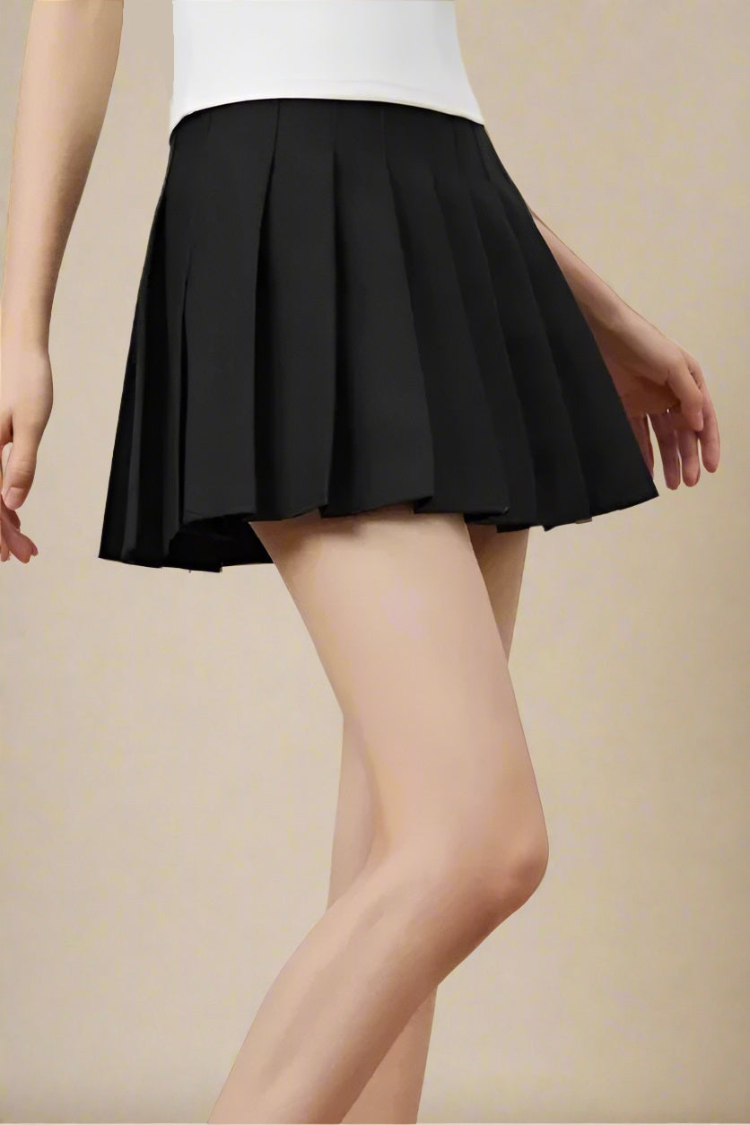 Woman wearing a figure flattering  Pleated Mini Skirt - Classic Black BODYCON COLLECTION Pty Ltd