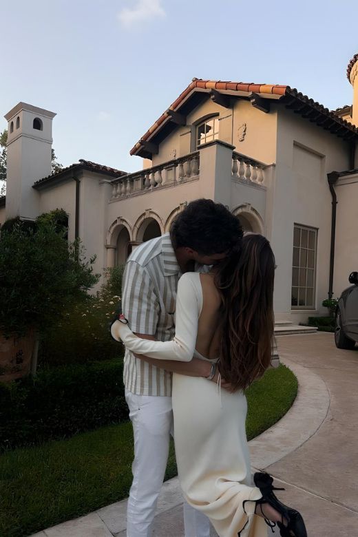 Woman wearing a figure flattering  Regina Long Sleeve Bodycon Maxi Dress - Ivory White BODYCON COLLECTION