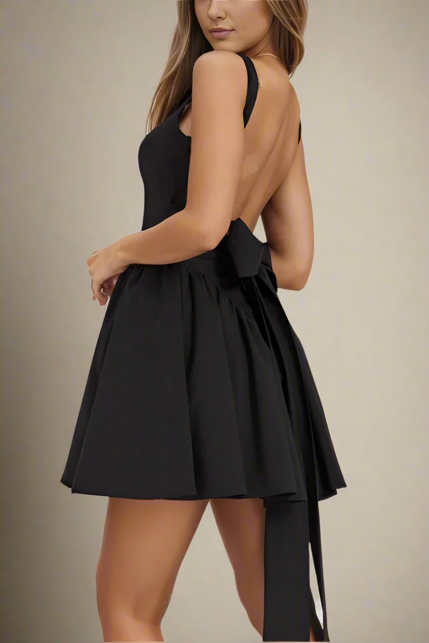 Woman wearing a figure flattering  Rian Bodycon Mini Dress - Classic Black BODYCON COLLECTION