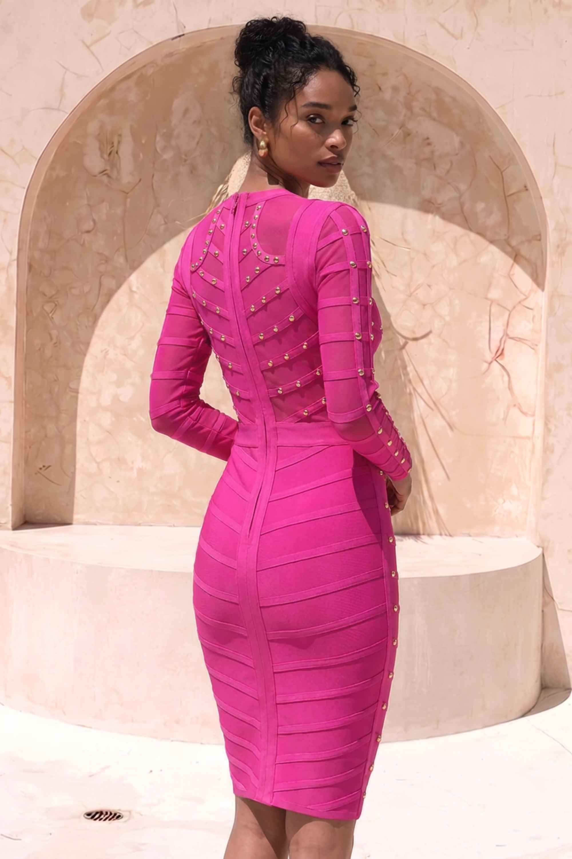 Woman wearing a figure flattering  Rosa Long Sleeve Bodycon Dress - Neon Purple BODYCON COLLECTION