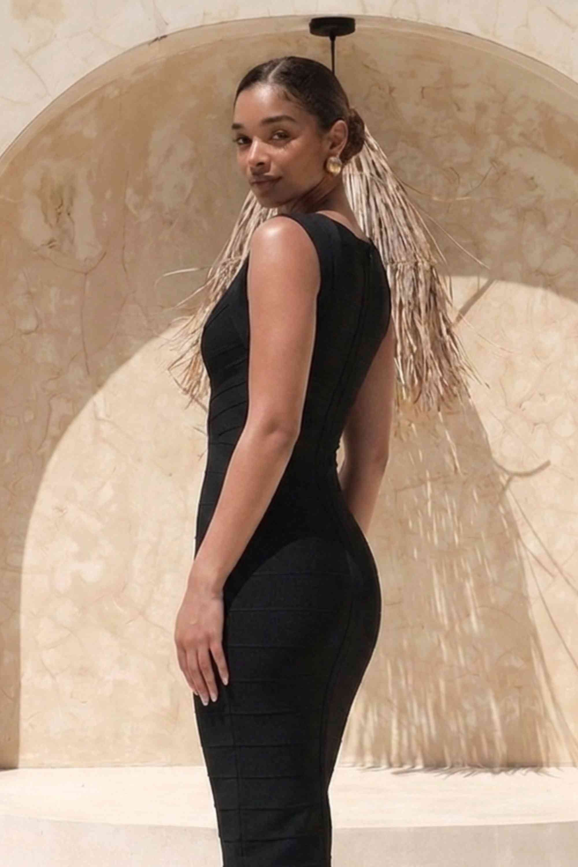 Woman wearing a figure flattering  Sabrina Bandage Midi Dress - Classic Black BODYCON COLLECTION Pty Ltd