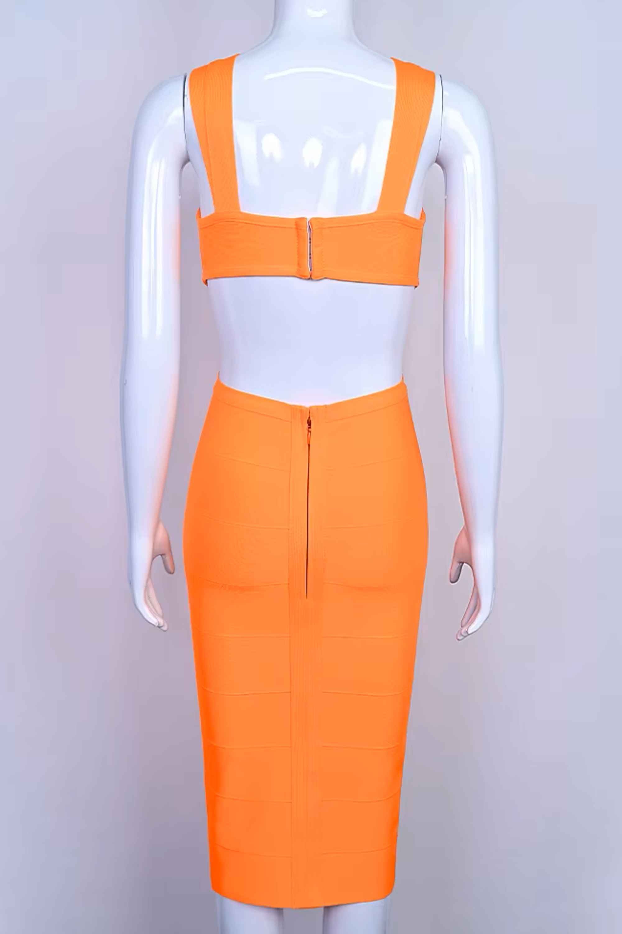 Woman wearing a figure flattering  Sasha Bandage Midi Dress - Apricot Orange BODYCON COLLECTION