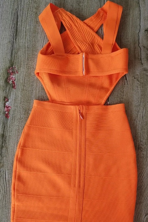 Woman wearing a figure flattering  Sasha Bandage Midi Dress - Apricot Orange BODYCON COLLECTION