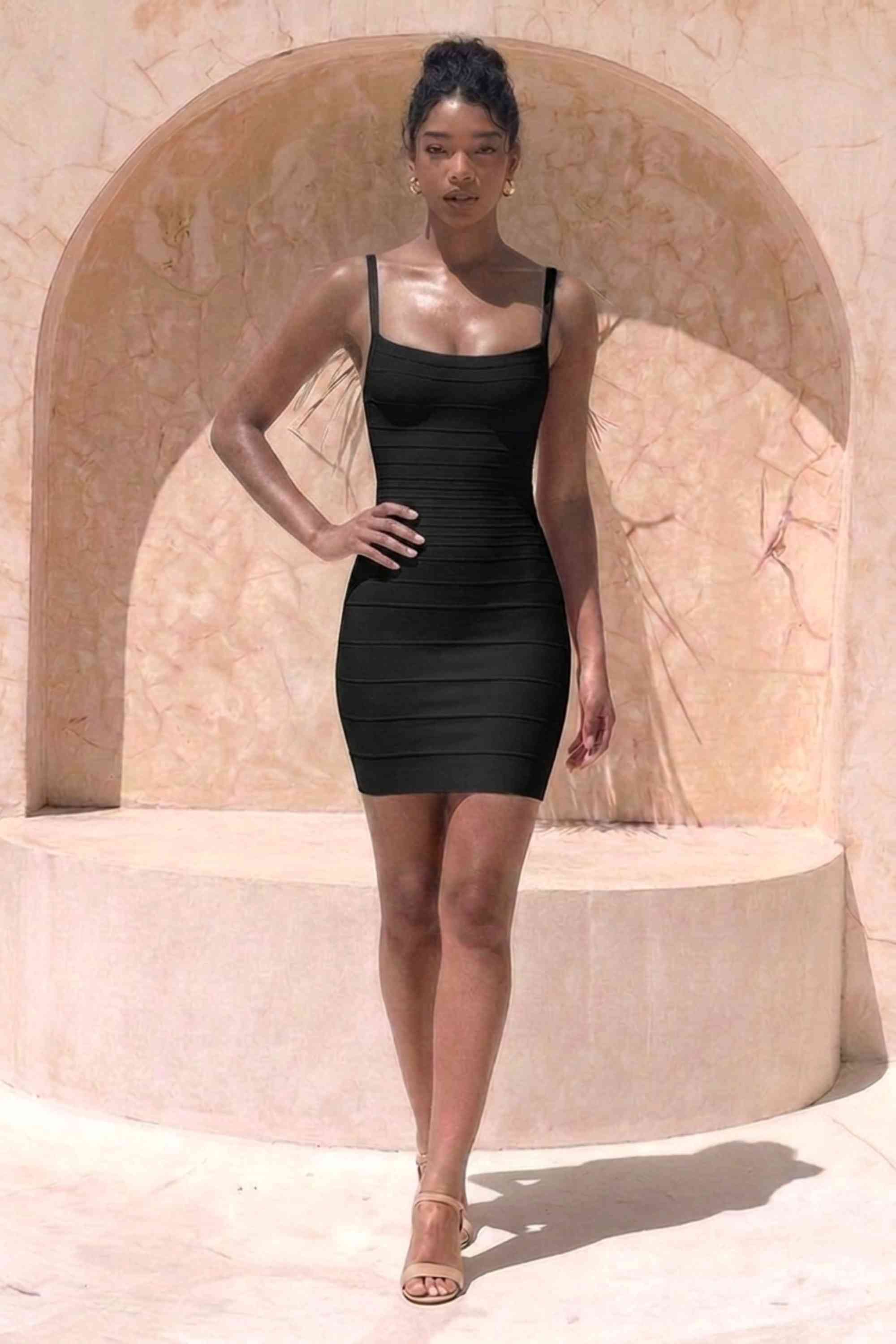Woman wearing a figure flattering  Scarlett Bandage Mini Dress - Classic Black BODYCON COLLECTION Pty Ltd