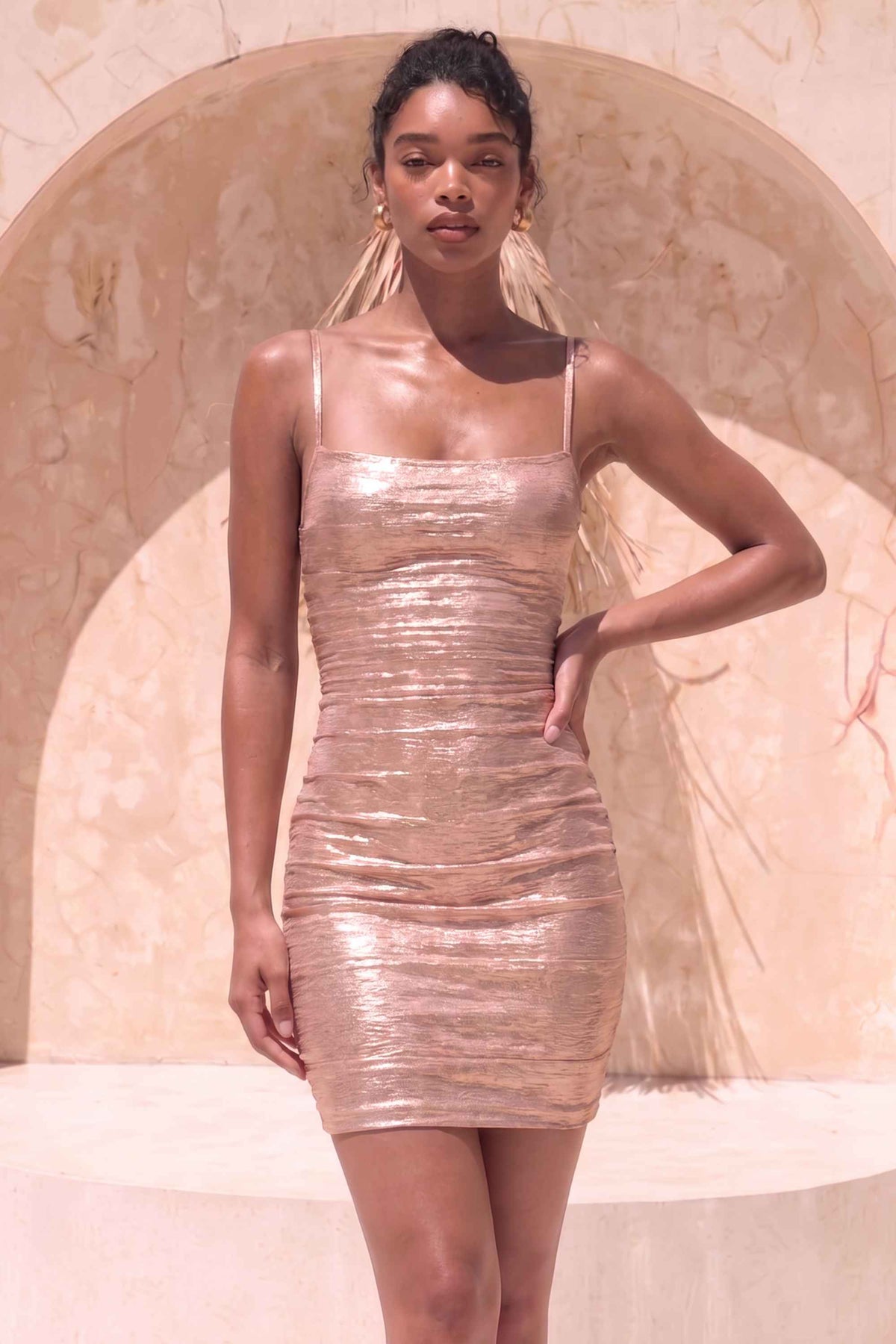 Woman wearing a figure flattering  Scarlett Bandage Mini Dress - Rose Gold BODYCON COLLECTION Pty Ltd