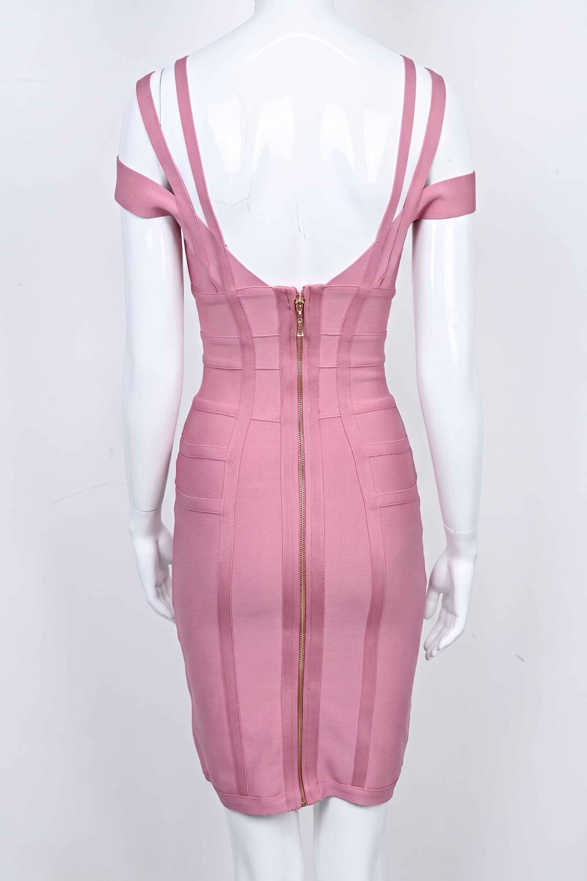 Woman wearing a figure flattering  Sia Bandage Dress - Ballet Pink Bodycon Collection