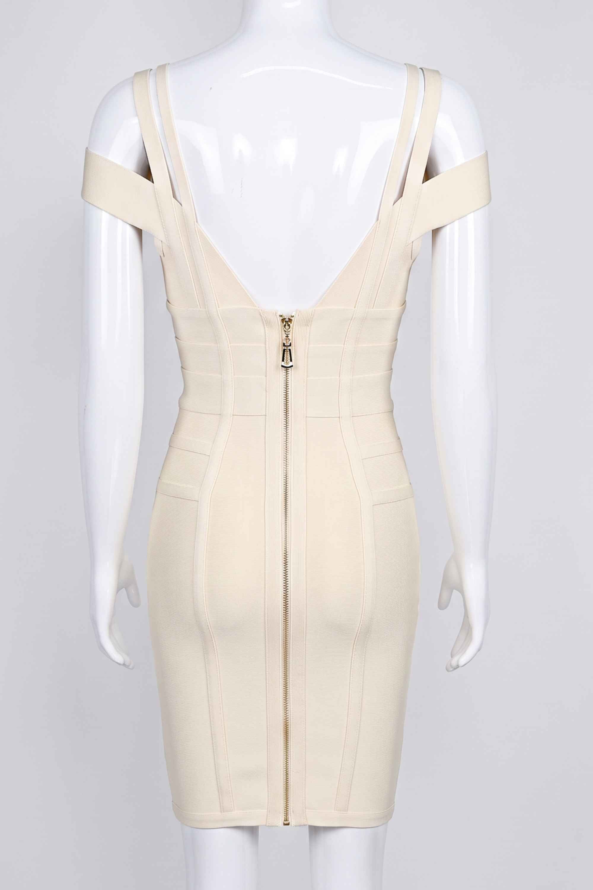 Woman wearing a figure flattering  Sia Bandage Dress - Cream Bodycon Collection